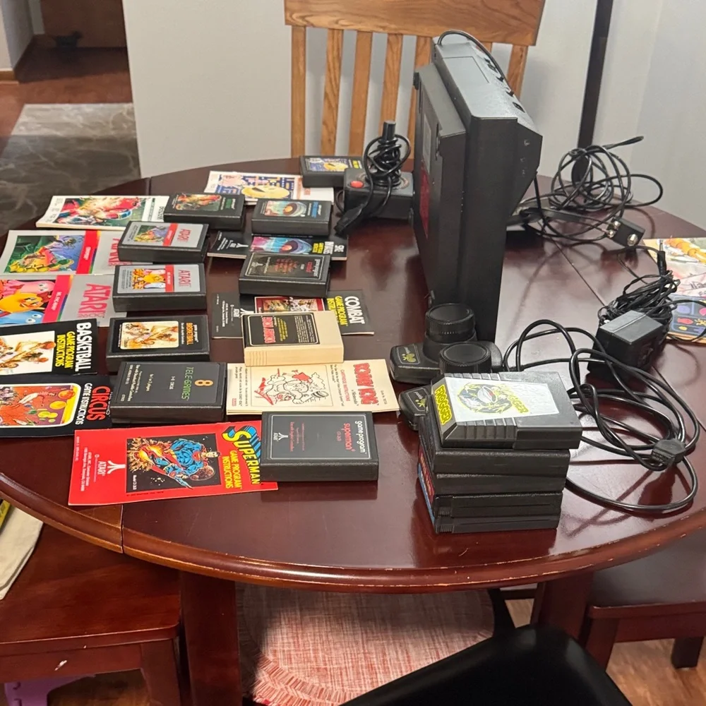 Vintage Authentic Atari 2600 with controllers, games and instruction booklets.